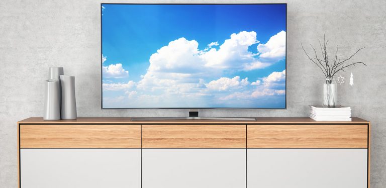 Flatscreen TV on modern TV stand