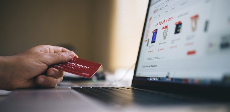Person using credit card to buy something online