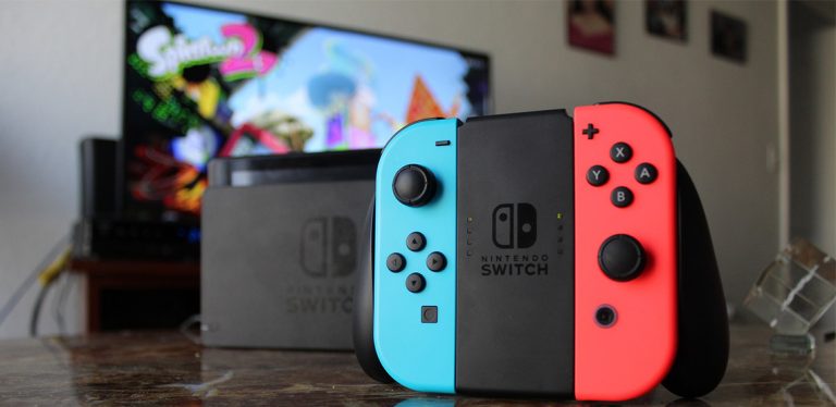 Nintendo Switch controller with TV in background