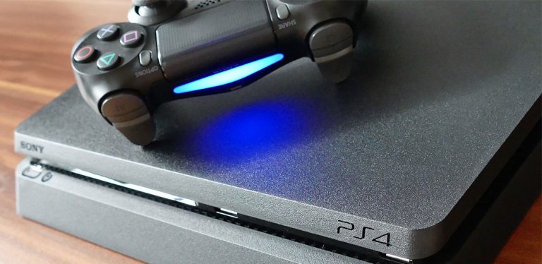 PS4 controller sitting on top of a PS4