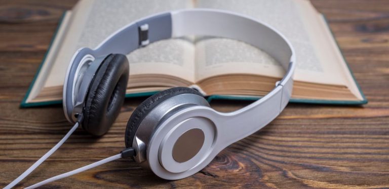 Headphones and an open book.